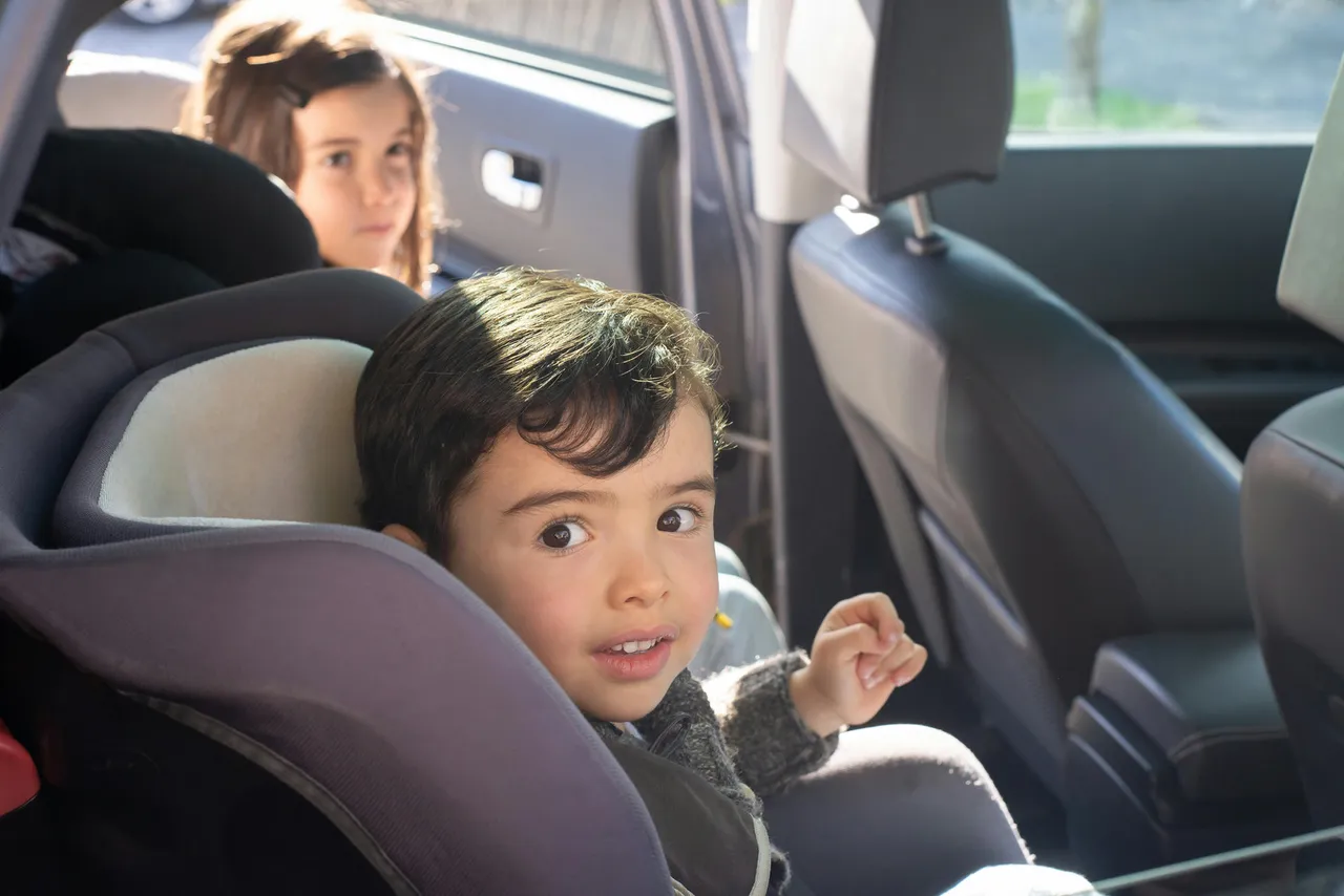 Kid in carseat Photo by Kampus Production: https://www.pexels.com/photo/boy-sitting-on-car-seat-6300862/