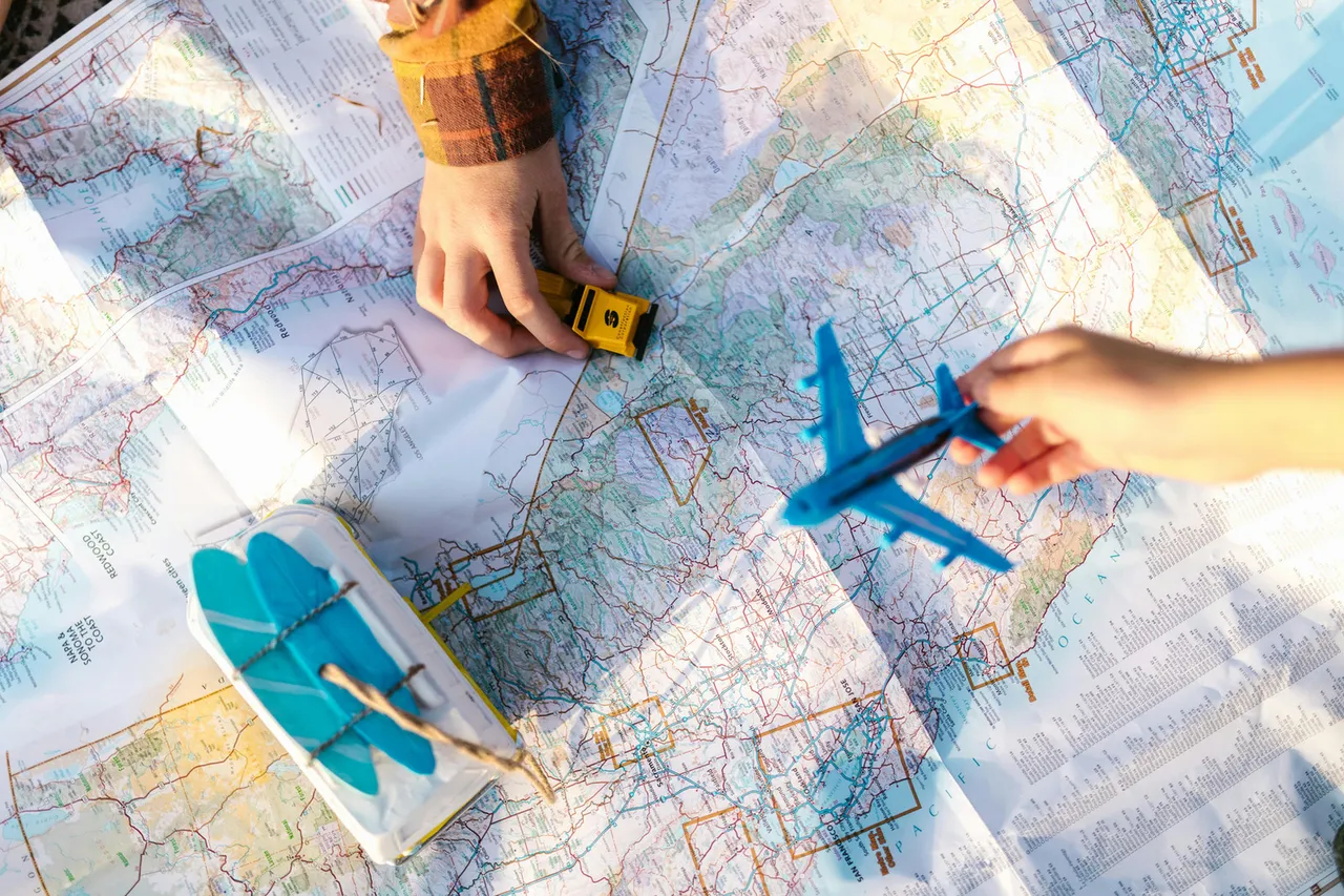 Planning family trip with a map Photo by RDNE Stock project: https://www.pexels.com/photo/close-up-shot-of-toys-and-a-map-8083429/